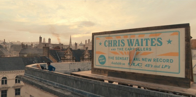 Panneau publicitaire Chris Waites sur le toit d'un immeuble